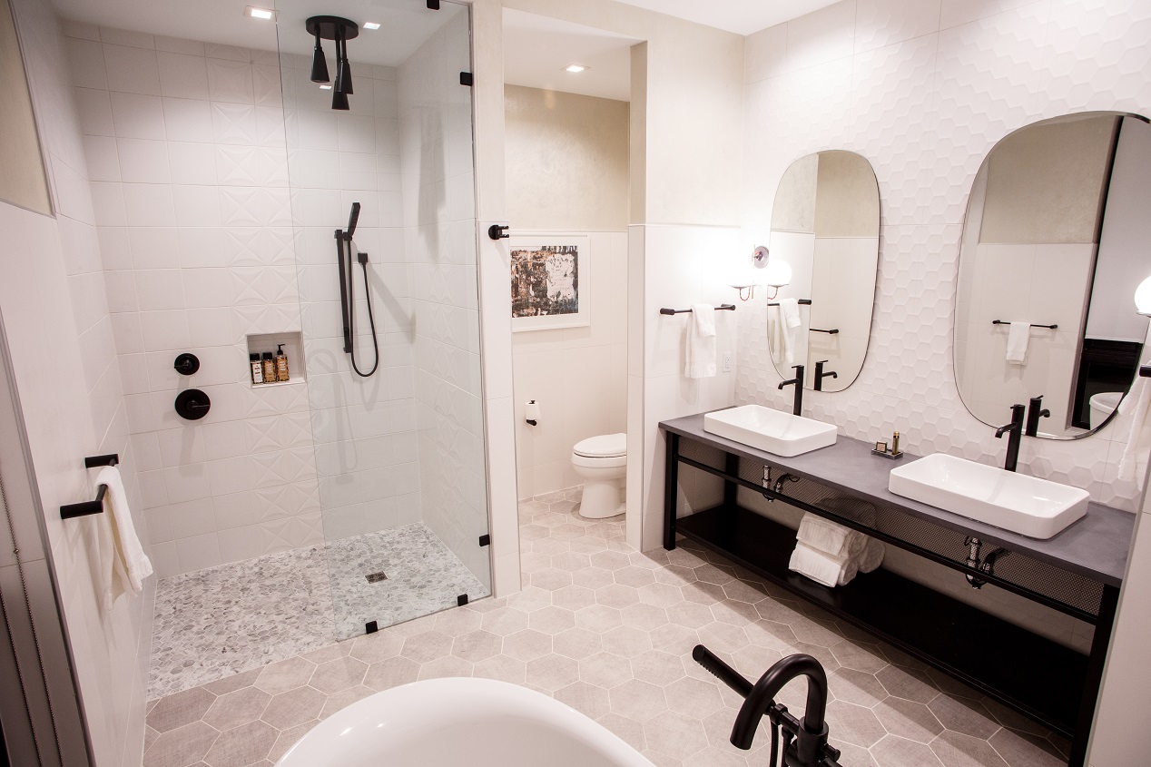 Hotel Rock Lititz Penhouse Suite beautiful white bathroom featuring full bathtub and standing shower