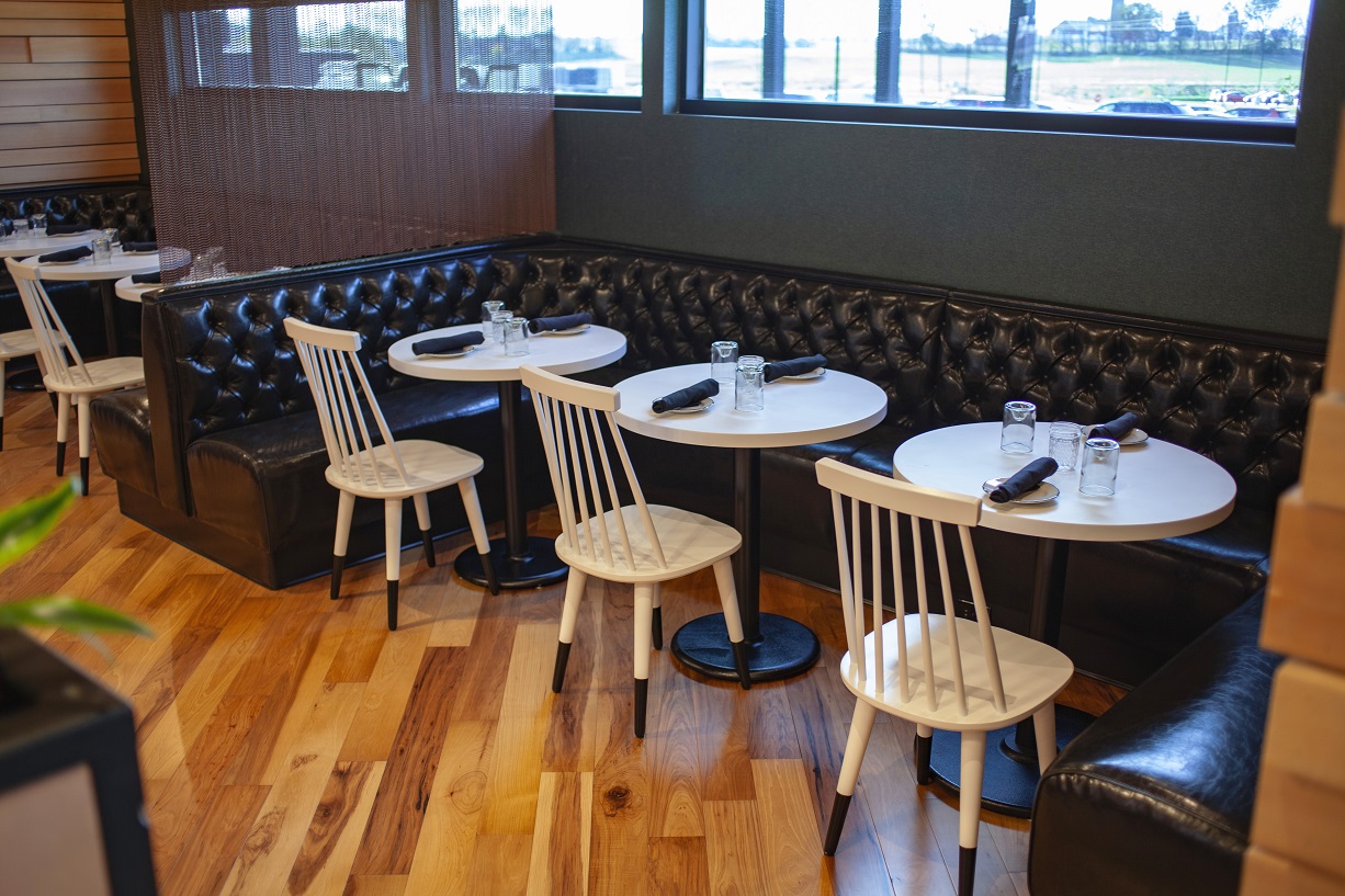 Per Diem's beautiful interior featuring chairs and bench seating